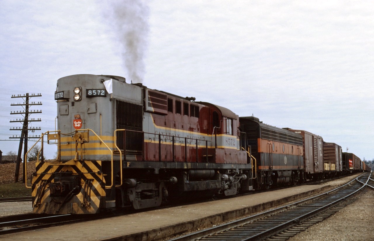 Dual Service RS10s 8572 leads an unidentified B&LE B-unit on an "extra west" through Guelph Jct in the spring of 1964. CP owned 53 RS10 and RS10s units, 38 of which were equipped with steam generators and enlarged fuel/water tanks. They were used on secondary passenger trains in eastern Canada, slowly being displaced by RDCs and passenger A-units as they became available due to train discontinuances.