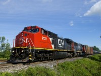 CN 585 (with TankTrain cars at the rear) is heading towards Coteau where it will work the yard. Power is spotless CN 2137 and CN 5719.
