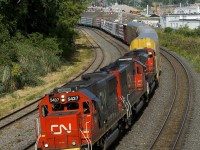 No longer as common in Eastern Canada as they once were, a pair of ex-Oakway SD60's (CN 5437 & CN 5431, along with SD70M-2 CN 8863 third) are the power on a very short CN 401 (38 cars) as it rounds a curve in Montreal West. The two SD60's had gone to Quebec City on empty windmill train CN X386 the previous night.