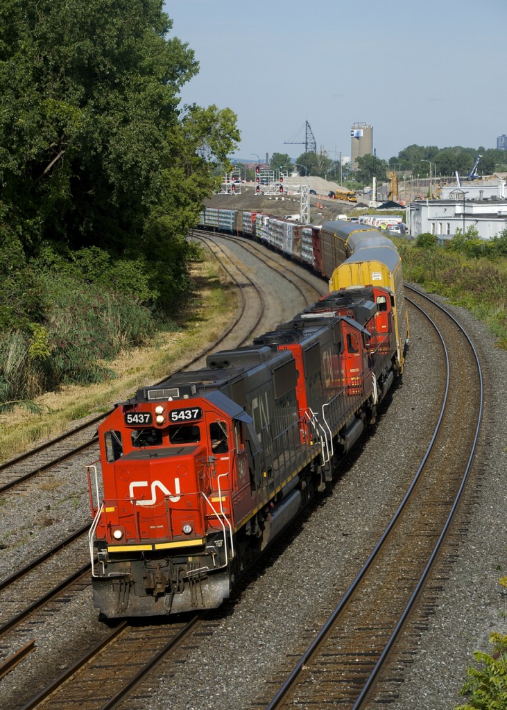 No longer as common in Eastern Canada as they once were, a pair of ex-Oakway SD60's (CN 5437 & CN 5431, along with SD70M-2 CN 8863 third) are the power on a very short CN 401 (38 cars) as it rounds a curve in Montreal West. The two SD60's had gone to Quebec City on empty windmill train CN X386 the previous night.