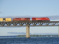 Fresh AC440CWM CP 8157 (rebuilt from CP 9646) and grimey CP 8931 lead CP 253 over the St. Lawrence River.