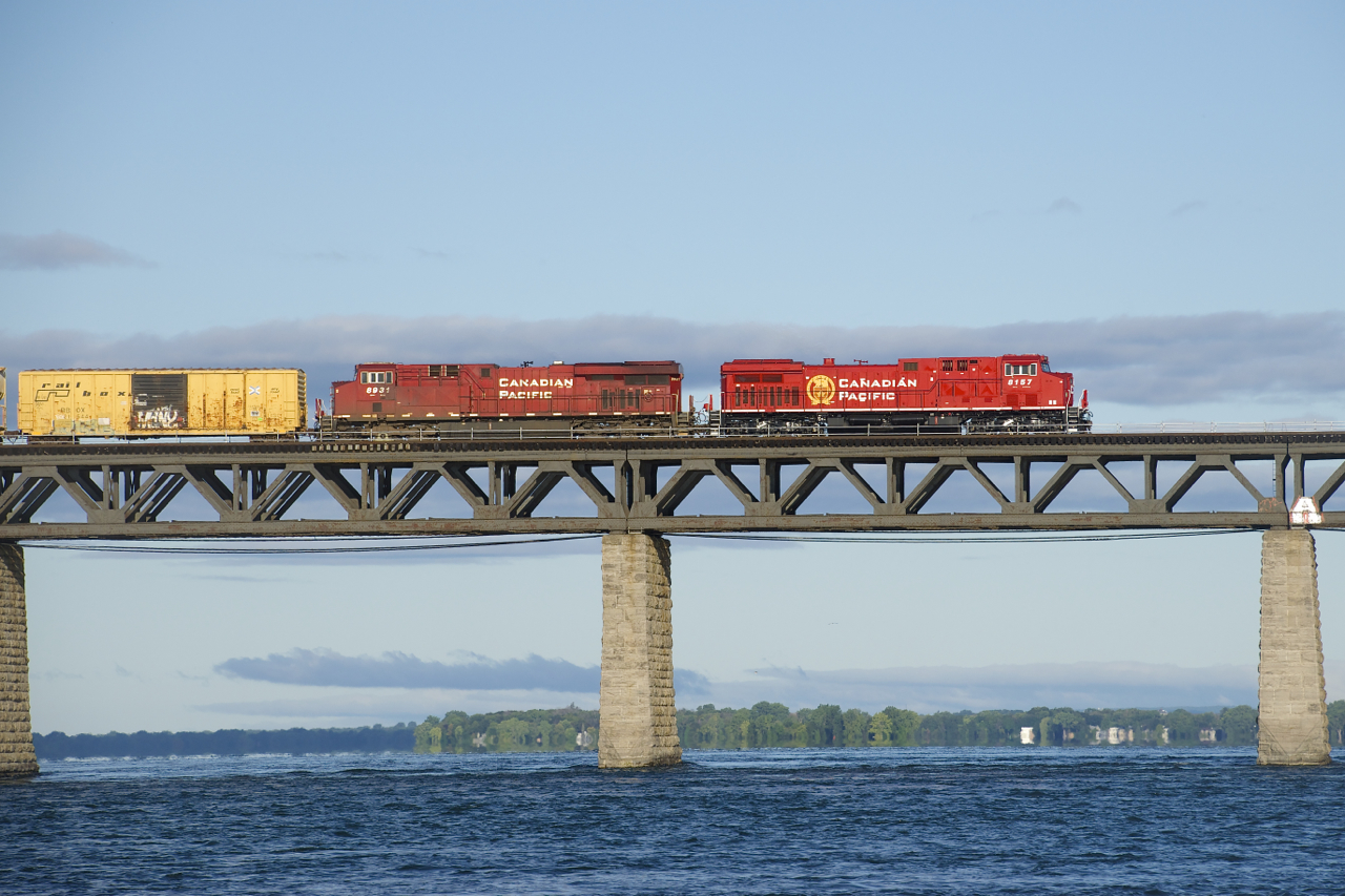 Fresh AC440CWM CP 8157 (rebuilt from CP 9646) and grimey CP 8931 lead CP 253 over the St. Lawrence River.