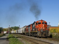 The Pointe St-Charles Switcher with CN 7229 (smoking it up) & CN 4129 are heading back to their namesake yard after picking up 37 loaded grain cars on track 29.