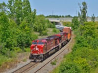 With rebuilt AC4400CWM 8127 up front, CP 254 drifts downgrade on the Hamilton sub at Newman Road.