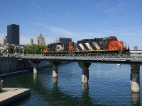CN 4129 & CN 7229 are leaving the Port of Montreal light after bringing nine cars in. Visible at left are crossing lights and gates that have been in service about a year now, replacing flagging which had been performed by port security.