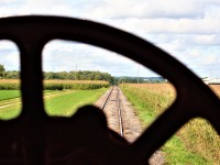 A crowd of onlookers gathers in the distance to photograph a reversing Waterloo Central Railway train at Scotch Line Road, which is located between St. Jacobs and Elmira on the Waterloo Spur. 