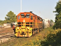 Goderich-Exeter Railway (GEXR) train 431 is arriving at Kitchener to set-off cars for the local assignments with RLHH SD40-2 3403 and GEXR SD40-2 3394. While this was a daily routine at the time, what is happening in the background in the yard is a sign of changes to come. Crews are busy working on the new module sections that would become the future CN operations centre, when the Guelph Subdivision would revert back to CN operations in less than two months. 

