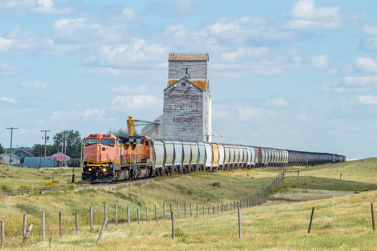 I departed Moose Jaw before sunrise on this Monday morning, and headed south for Assiniboia, home of the Great Western Railway. I got to town shortly before 0630, and the shop crews had just fired up 563 and 575, which the crew of 777 would be using for the day. The crew for the day's job arrived at around 0700, and worked the yard for a while and got paperwork sorted before departing around 1100. They left with 28 hoppers of frac sand for Dollard, 35 tanks to be set off in storage at various points along the way, and 24 of their own grain hoppers (purchased Saskatchewan hoppers) to be set off along the way. Their journey would take them as far as Dollard, where another crew was to take over and continue heading onward. This particular run west out of Assiniboia for the GWR is long and slow, and takes multiple crews multiple days to get there and back. They make set offs heading away from Assiniboia, and lifts on the way back. In this particular shot, they are coming up past the old Pool elevator in Aneroid, where they would set off tanks for storage. I checked a rail somewhere west of here as they worked - 85 lbs and dated 1938.