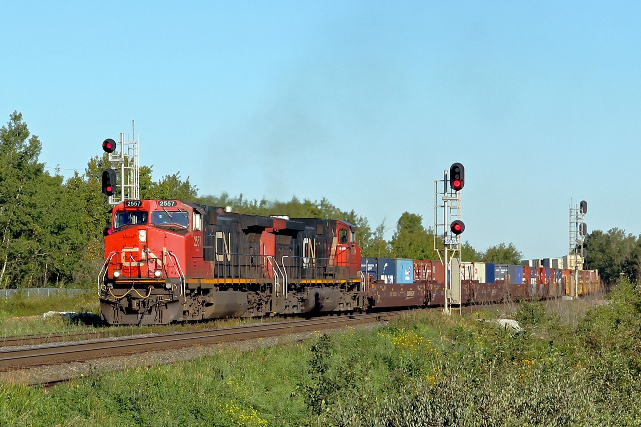 A pair of DASH 9-44CW's take an eastbound intermodal onto the south track at Ardrossan.