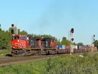 A pair of DASH 9-44CW's take an eastbound intermodal onto the south track at Ardrossan.