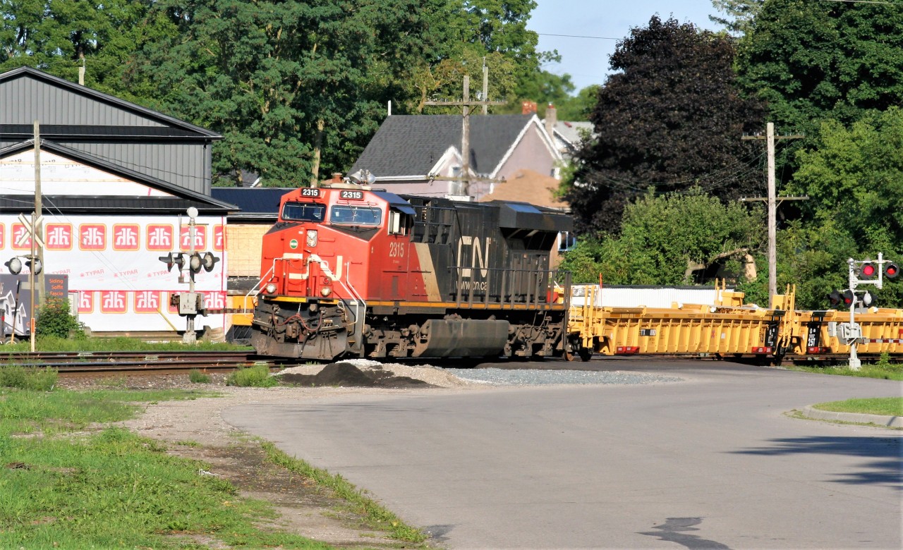 CN 2315 leads train 331 over Market Street in Paris and ahead of VIA Rail 75 as well as two other CN westbound's following the passenger train.