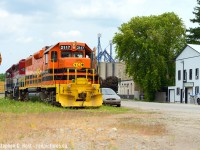 GEXR 581 is shown working the town of Hensall, Ontario, heading up grade alongside Wellington St. You can barely see the track , but it's there, and the crew will lift 2 cars out of WGT in Hensall to take back to Stratford. Light power from Stratford, 2 cars back. That's it. But with service on the branch 2 days a week ( up from one ) this is how you build the business again. James Knott later <a href=http://www.railpictures.ca/?attachment_id=38605 target=_blank>showed evidence</a> it's working!