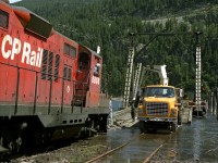 Power on the Nelson to Nakusp wayfreight helps the Bridge crew make adjustments to the slip dock on the south end of Slocan Lake. After adjustments are made for changing lake levels the 8808 will load itself and train onto a barge to be tugged to Rosebery for the isolated Kaslo Subdivision