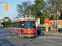 Toronto Transit Commission Canadian Light Rail Vehicle 4085 heads west on the TTC’s 506 Carlton line, at the corner of Gerrard and Blackburn, trundling down Gerrard Avenue. These Canadian Light Rail Vehicles were constructed by Bombardier-predecessor Urban Transportation Development Corporation (UTDC) from 1978 through 1981. After nearly 40 years of service (beginning on September 30, 1979), the CLRVs will be retired soon – probably by the end of 2019. The iconic CLRV is seen passing an equally, if not more, iconic Tim Hortons! (August 30, 2019)