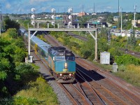 Rushing through Pickering Junction (in Pickering, Ontario), VIA Rail Canada train 52/62 heads east.  This combined <i>Corridor</i> train, comprised of F40PH-3 6439 and five LRC cars combined with F40PH-3 four more LRC cars, is heading from Toronto to Kingston, at which point the two trains will be separated with 52 continuing on to Ottawa and train 62 travels to Montréal.  Pickering Junction is where Canadian National's York Sub splits from CN's Kingston Sub.  (August 25, 2019)