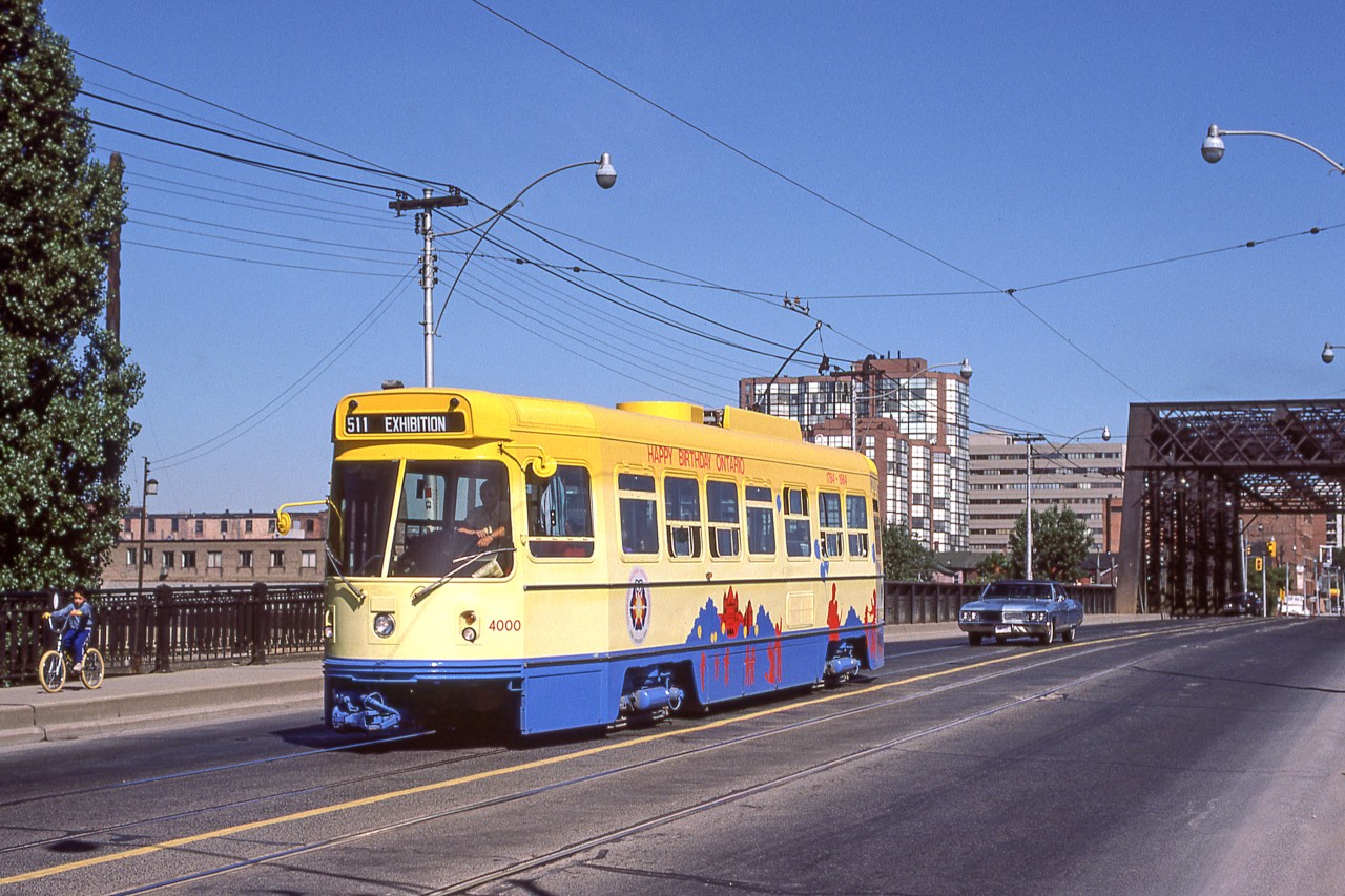 TTC 4000 is wearing its "Happy Anniversary Ontario" paint scheme in Toronto on August 25, 1984.