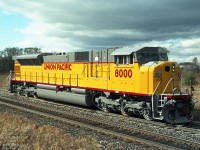 UP 8000 was the first production SD90MAC, with the well-proven 4300 HP EMD V16 710G3B 2-stroke diesel engine installed "temporarily" until such time as the intended 6000 HP EMD GM16V265 4-stroke diesel was sufficiently developed. It is seen here on the GMDD test track beside CP's Galt Subdivision. <br><br>
The 265-H engine had far more problems than anticipated, so over 400 more SD90MAC locomotives were built with the 710G3B engine, becoming known as "SD9043MAC". Original customers were UP, CP, and CEFX.<br>  
None of the SD9043MAC units were ever converted to the 6000 HP engine by a railroad, because production SD90MAC-H locomotives with the 265-H engine were so unsuccessful.<br><br>
Over 100 ex-UP and ex-CEFX SD9043MAC locomotives have been remanufactured to SD70ACU for Norfolk Southern.<br>  Canadian Pacific is getting the same thing done with their SD9043MAC fleet.     
