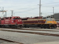 A pair of locos getting serviced including heritage SD70ACu as the leader for train 101.