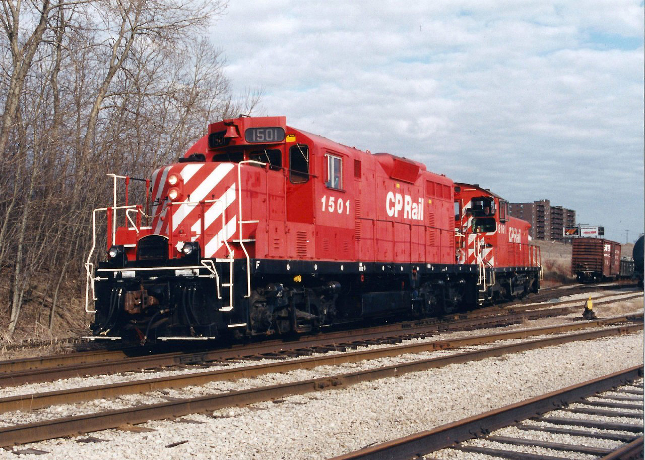 The afternoon Galt Job with CP GP7u 1501 and SW1200RS 8161 have just set-off cars at the interchange (South Junction) with CN in Kitchener, Ontario. The units are slowly approaching the Hayward Avenue crossing and will soon reverse and head to the opposite end of the interchange where they will lift any cars that CN had left for them, before returning back to Galt on the Waterloo Subdivision.