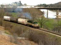 Goderich-Exeter Railway (GEXR) GP9 177, departs the large Sifto Salt mine in Goderich, Ontario with three hoppers and heads up the steep grade towards the yard on April 28, 1995. The former Cartier Railway unit would operate on GEXR until 2002, after a damaged main generator sidelined it for good.