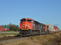 Train 120 is approaching the John Bell Road just to the north of Brookfield, Mileage 56.0  The power includes SD70M-2 8022 (GMDD 2007), 5706 2996 and DPU 8928.  At Brookfield, the stive active 2.8-mile Canada Cement Spur diverges to the west. 