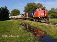 CN 9450 and CN 9461 shove a cut of hoppers full of fertilizer into the elevator in Sarnia, ON.