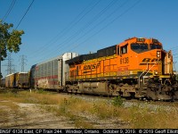 "Keep'n Cool".... Well maybe not, but the crew decided to leave the door open on BNSF 6138 while they were running out to Walkerville to put a CP leader on the head end.