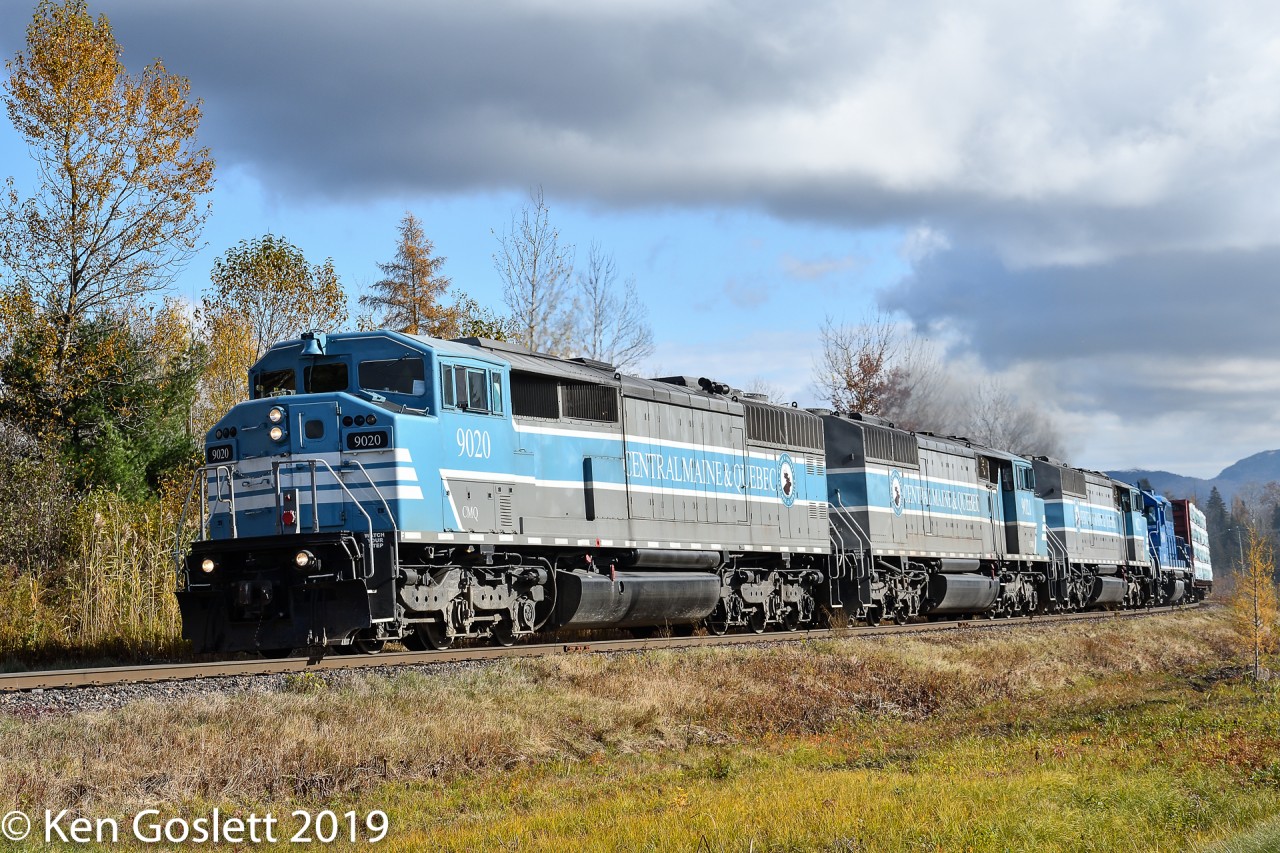 With consequtively numbered Blue Barns and a leaser, CMQ #1 tows 77 cars west toward Farnham QC along the Sherbrooke sub.
