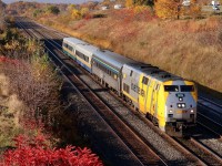 Still one of my favourite locations from over the years, considering it’s surrounded by a lot of urban sprawl the view here hasn’t been altered too much over the years. Two tracks have grown to four and the old brick works that once sat just out of sight to the left has since become a new residential neighborhood. The crisp autumn colours are everywhere as VIA train 70 heads for a station stop at Aldershot just a half mile ahead.