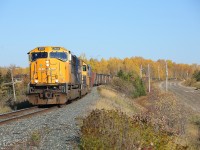 2101 and 1734 lead 56 mixed cars (including a generous string of ONR boxcars) as they glide through the serpentine curves at Matheson.