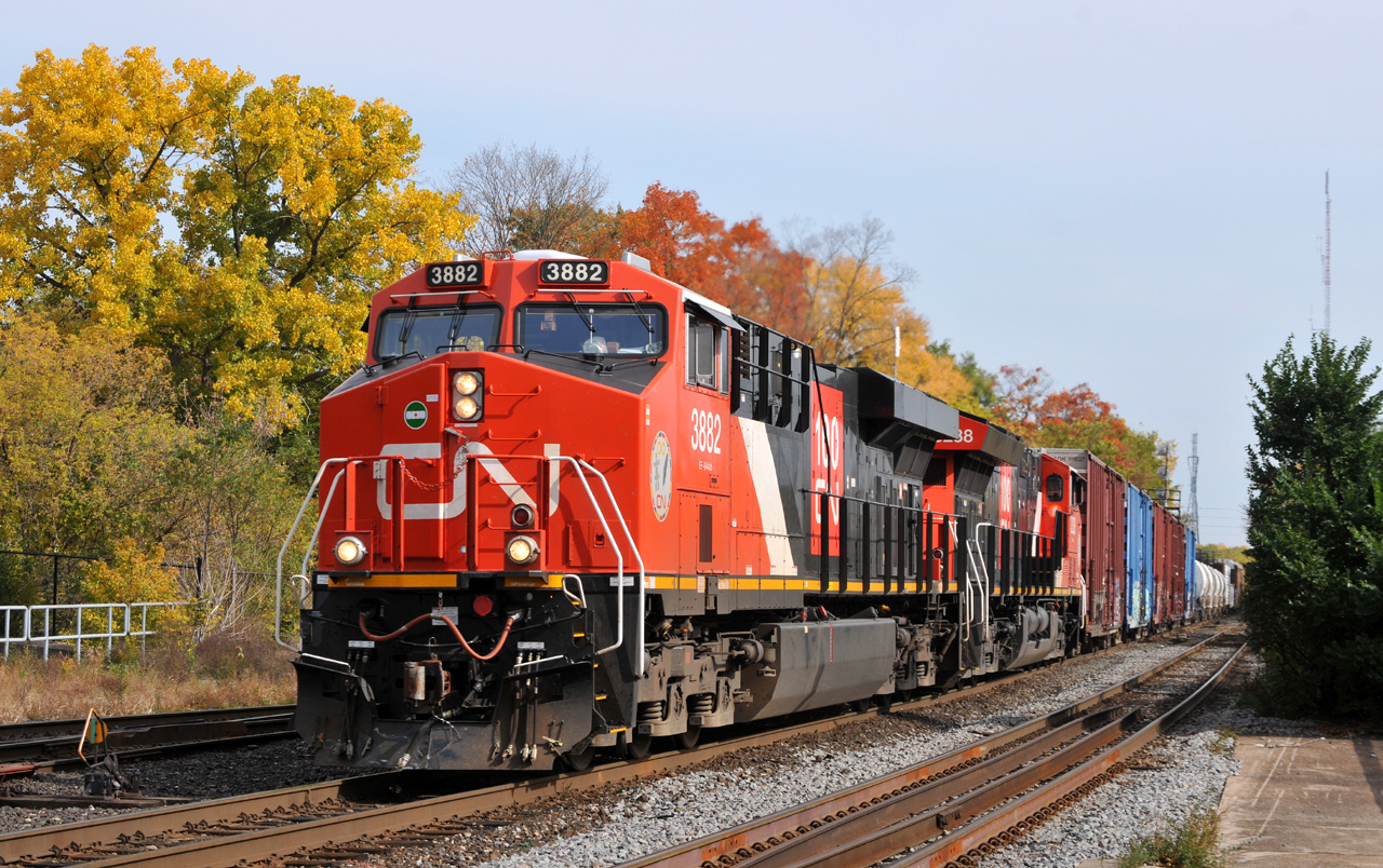 A late running M38531 21 passes through Brantford with CN 3882, CN 3238, and 160 cars
