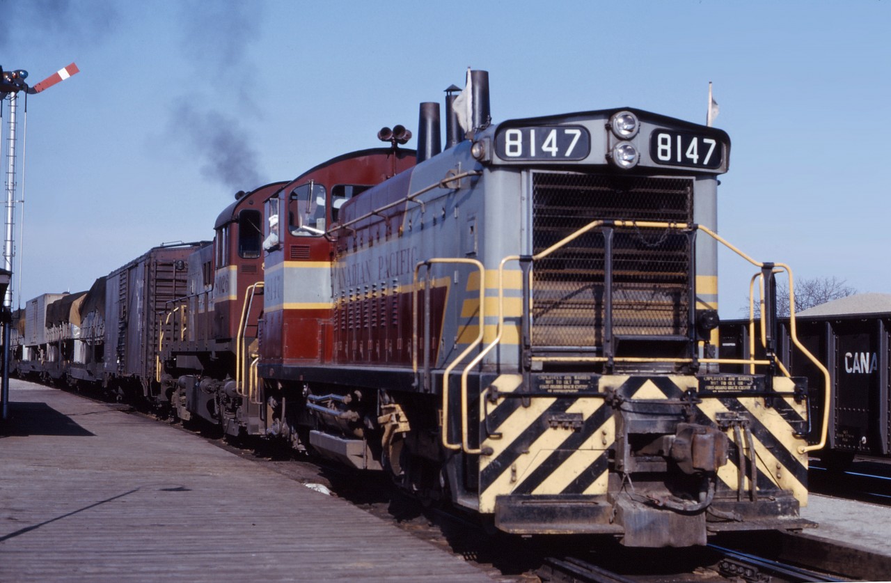 SW1200RS 8147 and RS23 8026 lead an interesting Extra West through Guelph Junction in the spring of 1964.