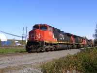 CN train #407 nears the end of it's journey from Dartmouth, NS as they roll through Marsh Junction with a quartet of Dash 9 locomotives, the third unit being a C44-9WL (2519)