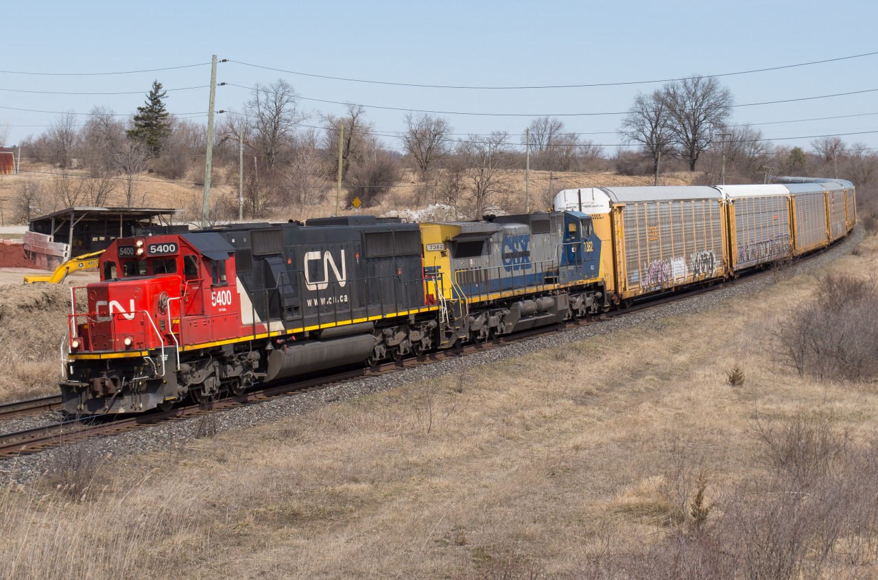 CN 393 approaches Garden Ave with a solid train of autoracks.  Providing the power on this day was CN 5400 and GECX 7362.