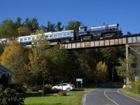 A very obscure locomotive model (MLW M420TR) brings up the rear of the Orford Express as it heads west, with the train having just gone over the Eastman trestle.