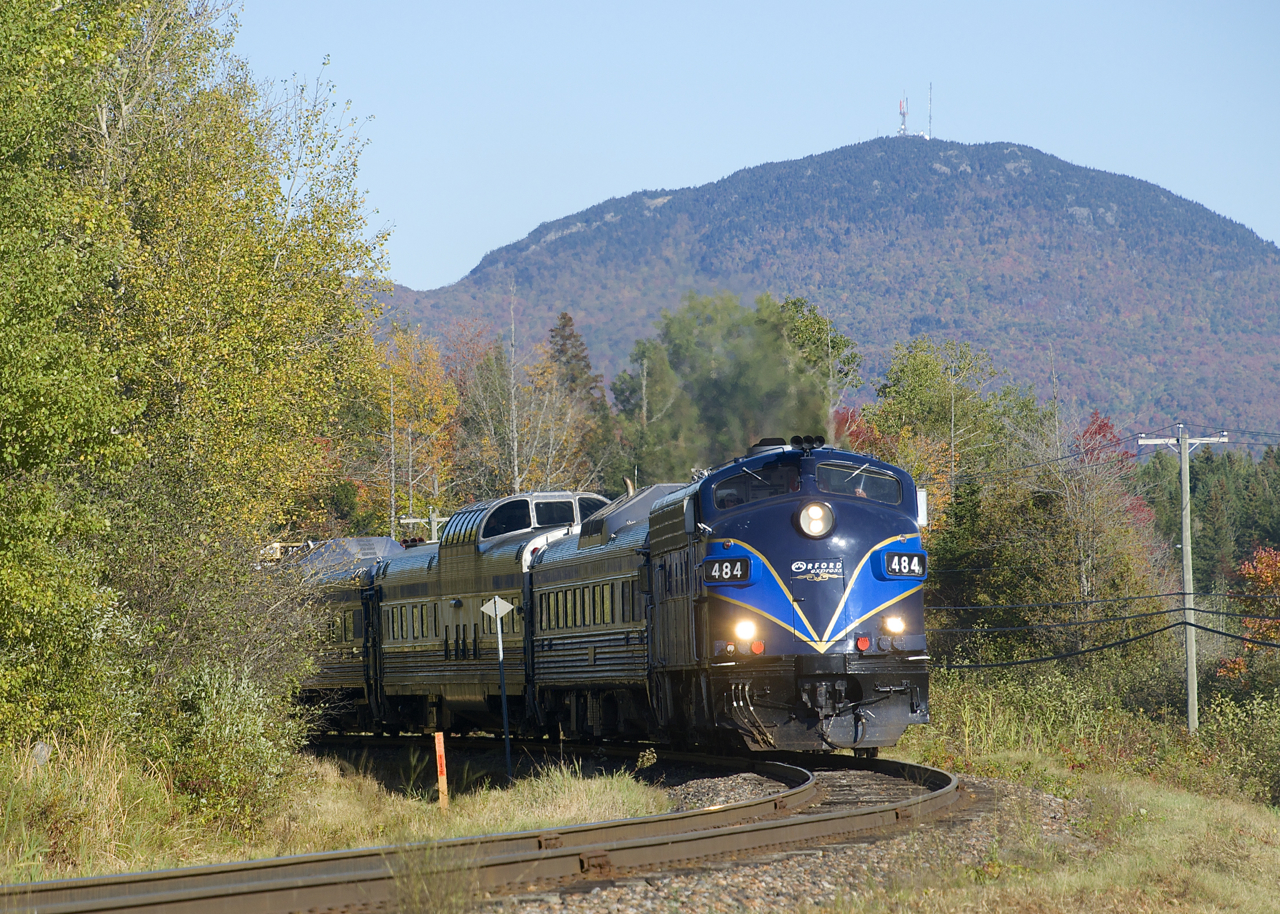 The afternoon run of the Orford Express is rounding a curve on CMQ's Sherbrooke Sub, on its way to Bromont. In the background is the train's namesake mountain, Mont-Orford.