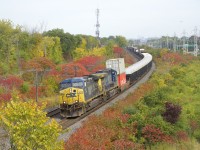 With a pair of AC4400CW's in the increasingly rare YN2 paint scheme (CSXT 467 & CSXT 483), CN 327 passes some nice fall colours as it heads west through Beaconsfield. The first car contains two containers bound for Philadelphia, part of a new CSX/CN intermodal service to/from Toronto and Montreal and Philadelphia, New Jersey and the New York City metropolitan area, which launched just this week.