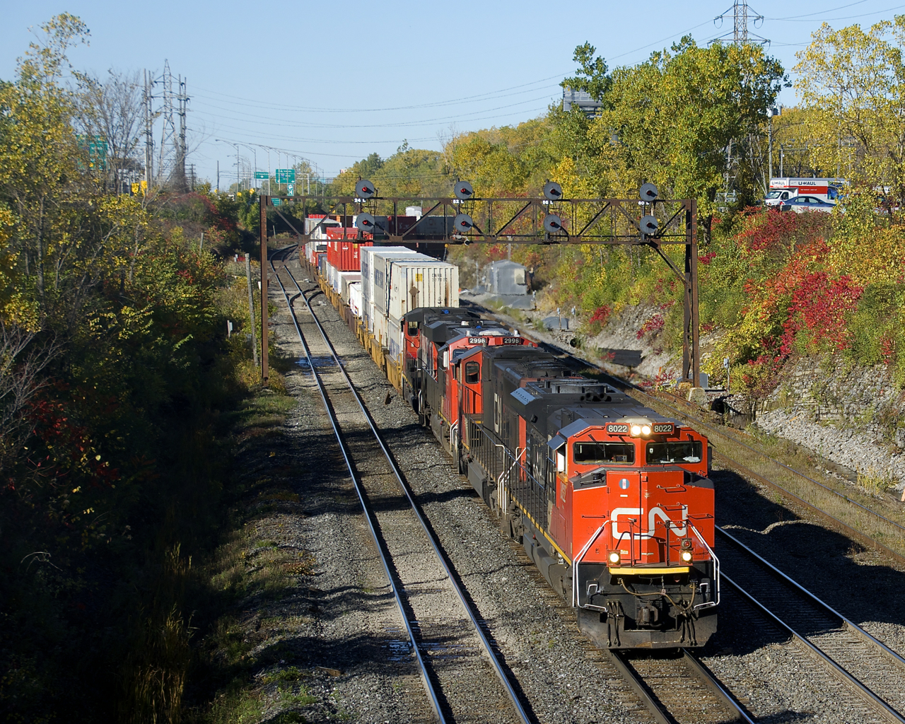 CN 120 has CN 8022, CN 5706, CN 2996 & CN 4802 up front (and CN 8928 mid-train) as it exits Taschereau Yard with intermodal traffic bound for the Maritimes.