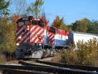 OSR M-420(W)s 647 and 644 back off the north industrial spur with four hoppers.  Their next task was to switch the south industrial spur, however CN 540 was on it.  What to do?  Walk to Tim Horton's of course.  I find Guelph horribly frustrating to navigate and lucked out with this shot.  I had abandoned my OSR chase to go search for CN 540... finding CN 542 instead.  After photographing 542 at Guelph Jct. I then found 540 on the Fergus Spur.  Not finding anywhere to photograph 540 I gave up, got twisted around in the industrial area and found OSR again.  You can plan all you want but sometimes the subjects you just happen upon end up being the best photos of the day.  It was today! 