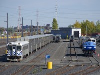 AMT 1344 and various passenger cars are in EXO's Pointe-Saint-Charles Maintenance Centre. AMT 1344 had been used earlier that week on a test train that ran from the CN St-Laurent Sub, through Taschereau Yard onto CN's Montreal Sub, a route that Mascouche trains are expected to take starting at some point in 2020 due to the multi-year closure of the Mount Royal tunnel.