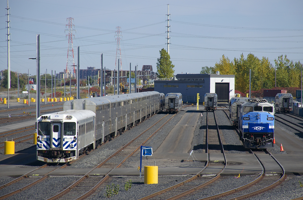 AMT 1344 and various passenger cars are in EXO's Pointe-Saint-Charles Maintenance Centre. AMT 1344 had been used earlier that week on a test train that ran from the CN St-Laurent Sub, through Taschereau Yard onto CN's Montreal Sub, a route that Mascouche trains are expected to take starting at some point in 2020 due to the multi-year closure of the Mount Royal tunnel.