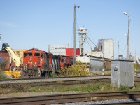 CN 7229 & CN 4129 are about to leave Ray-Mont Logistics after dropping of three loaded grain cars. This client is located adjacent to CN's Montreal Sub and Pointe St-Charles Yard and grain is transloaded here for further shipment.