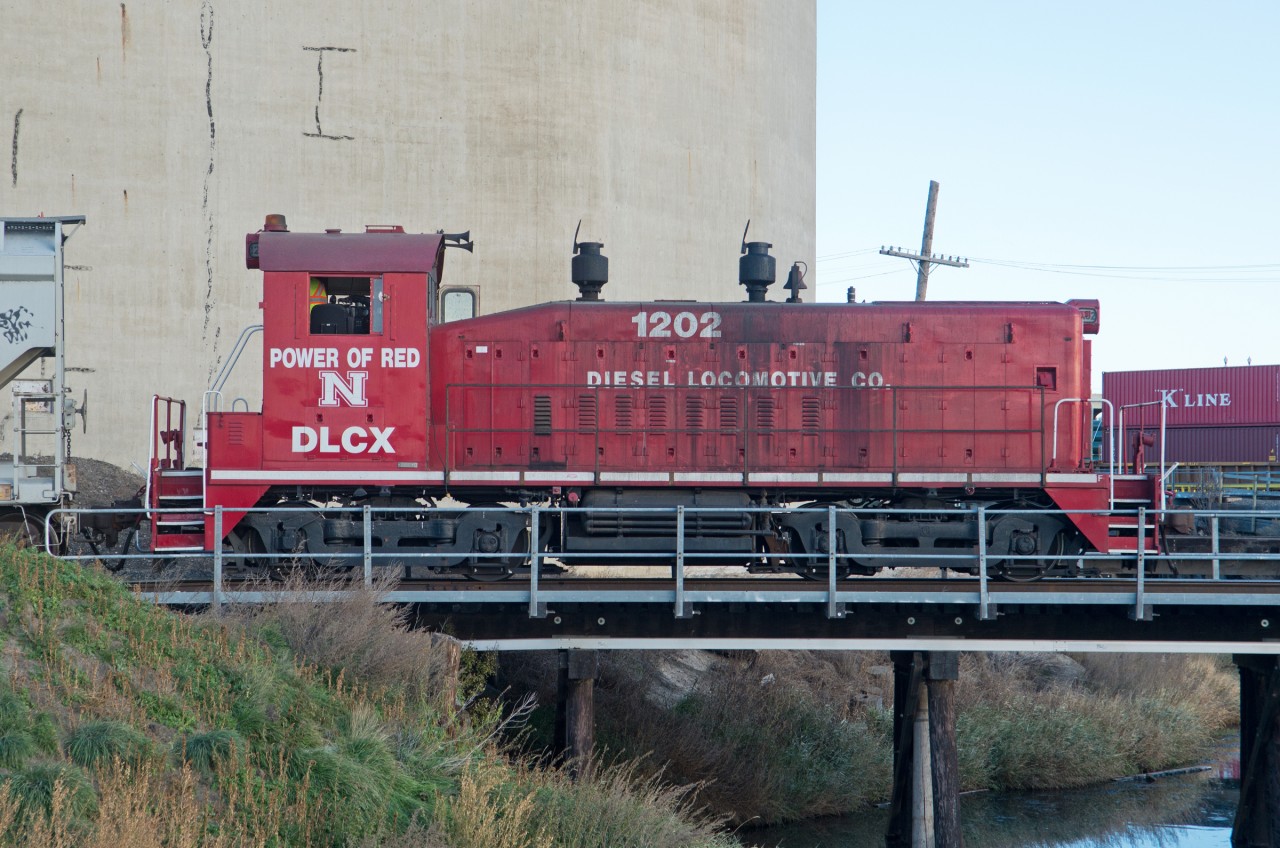 DLCX 1202 is the latest plant switcher at the P&H elevator in Moose Jaw.  Adorned in the colours of the NCAA Nebraska Cornhuskers, this unit looks quite out of place in the middle of "Rider Nation".