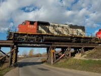 CN 5293 is seen leading a set of light power on the Central Butte Sub through the north end of Moose Jaw Saskatchewan. There are no less than three bridges in town with similar paint jobs. 