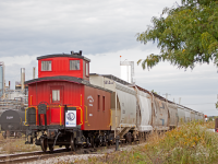 <b>Something to look twice at...</b> In a train consisting solely of plastic pellet hopper cars (and two old soul MLW's), a 1920's era CP caboose tends to stand out a bit. Most day's on the OSR are like stepping into a time capsule. But today OSR put the Guelph Railway Historical Associations (GHRA) restored and newly painted caboose on the tail end of their local and acted like the last 70 years didn't happen. Was a sight to see for sure.
<br><br>
The purpose of this move was to place the caboose on display in downtown Guelph for Rail Safety Day. In the weeks leading up to this, a lot of time and effort was put into the caboose by the members of the GHRA. This included repainting pretty much all the exterior and sprucing up the interior, not to mention volunteering at the event itself. The photo above doesn't give it justice for how good the caboose really looks, job exceedingly well done gents!
