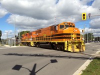 Goderich-Exeter Railway (GEXR) train 516 is viewed crossing busy Ottawa Street in Kitchener on the Huron Park Spur. During this time, the crossing gates here did not properly function and all movements had to be protected by a member of the crew. This practice continued into the CN takeover, which was less than a couple months away. That morning, 516 was ordered from Stratford with GEXR GP40-2L(W) 3030 and QGRY GP38-2 2008. The train operated to Kitchener to set-off and lift traffic at the bustling interchange with Canadian Pacific. To the right of the units was the newly completed ION Light Rail network that would eventually begin operations in June 2019.

