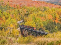 CN 306 crosses the trestle at Saint-Eleuthere, PQ with Fall colors filling the hillside. 