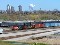 I'm not convinced i'm standing in the same spot as <a href=http://www.railpictures.ca/?attachment_id=39179 target=_blank>Doug's shot of similar location in 1964</a>, but i'm close. Here's the 2019 view from near the end of Crooks St - Crooks St is almost unshootable now as the trees have grown ever taller, but you can walk down an embankment recently cut down of trees (by the landowner, as it blocked their view!). A couple Canada Geese stare me down as 422 passes eastbound on the Oakville sub. The harbour as seen in Doug's shot was filled in, not sure initially what for but now for the park. The hillside must have been wide open in the 60's.