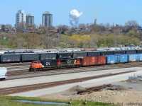 I'm not convinced i'm standing in the same spot as <a href=http://www.railpictures.ca/?attachment_id=39179 target=_blank>Doug's shot of similar location in 1964</a>, but i'm close. Here's the 2019 view from near the end of Crooks St - Crooks St is almost unshootable now as the trees have grown ever taller, but you can walk down an embankment recently cut down of trees (by the landowner, as it blocked their view!). A couple Canada Geese stare me down as 422 passes eastbound on the Oakville sub. The harbour as seen in Doug's shot was filled in, not sure initially what for but now for the park. The hillside must have been wide open in the 60's.