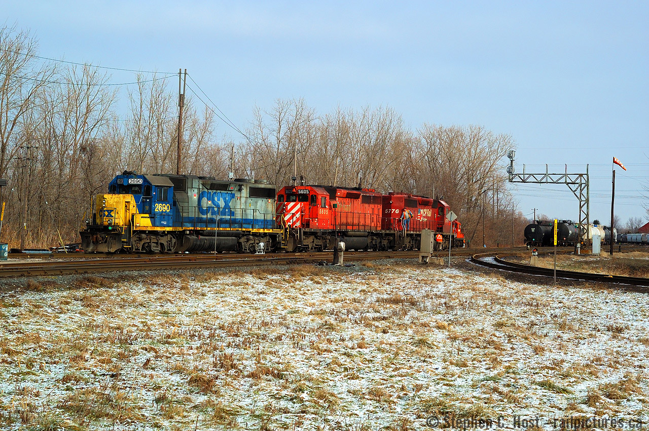 I arrived at Chatham chasing D725 south just before noon and was 30 minutes ahead of the southbound train, as I waited I noticed the outbound crew (D724) getting on the power to double onto their train and head north, but not until the inbound D725 yarded and sent the crew back to Sarnia in a taxi. What peaked my interest was a CSX unit heading back to Sarnia after 92 day inspection in the US, so I clicked a few pictures and this one turned out. I had plans to shoot the ETR in Windsor so I didn't chase north. Note the dwarf for the other leg of wye from CSX to CP. Oh to do this again.. there was a pair of CP GP9's just behind the CSX power in the CP yard.. I didn't even walk up to it for a close-up shot.